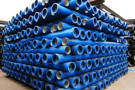 Blue Jindal pipes stacked neatly