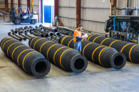 A Beaver Group employee assessing mine hoses