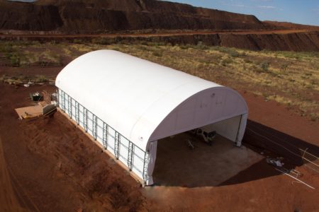 A dome shelter protects mining equipment from the elements